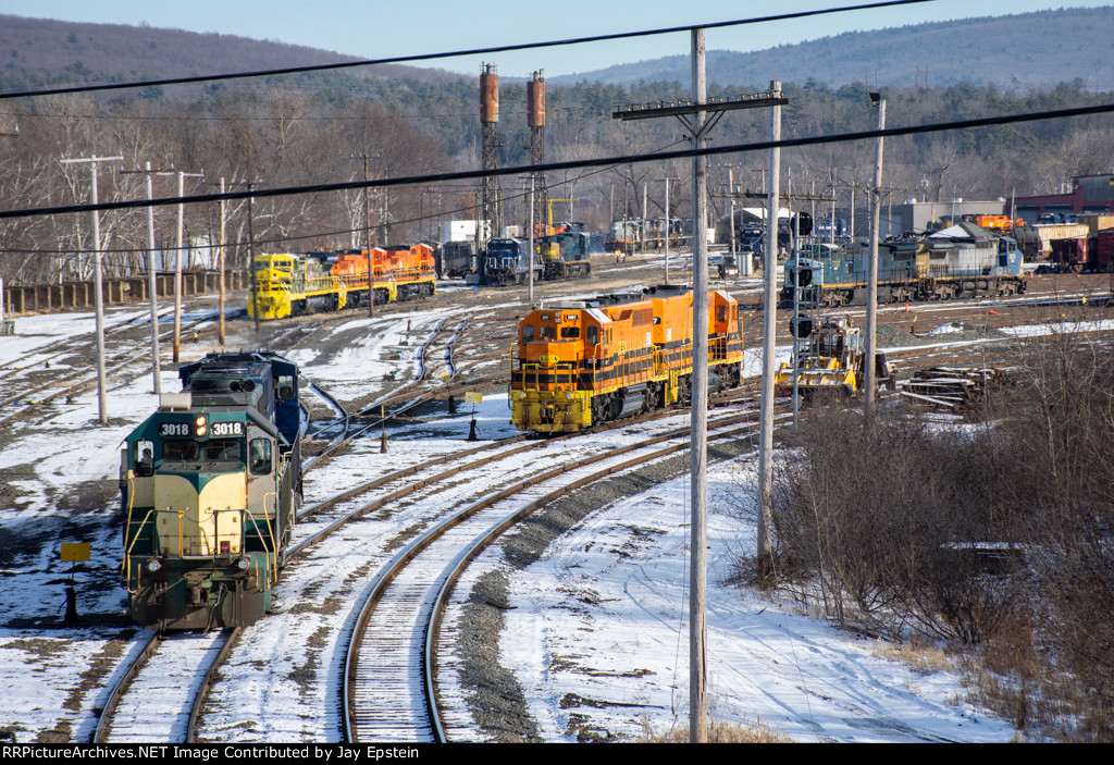 ED-9 backs onto the their train while another local waits 